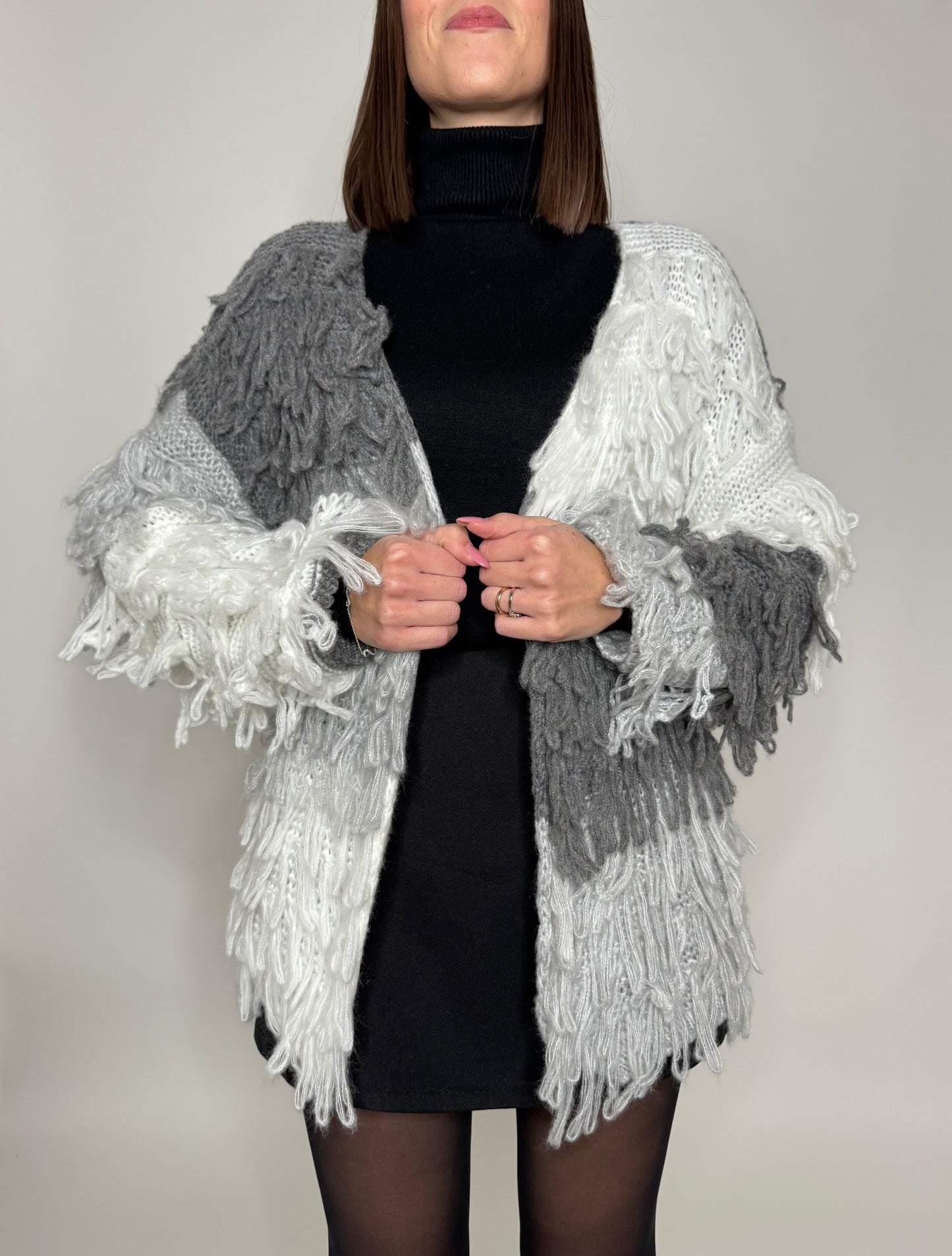 Cardigan con frange in maglia
