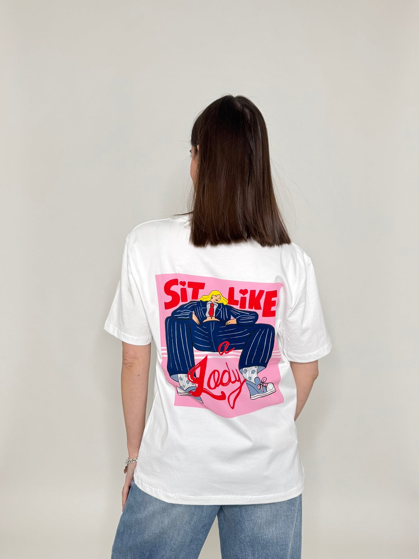 T-shirt in cotone con stampa "Sit like a Lady"
